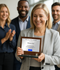 Woman Holding Aspire Wood & Glass Corporate Award Plaque – Elegant Annual Recognition