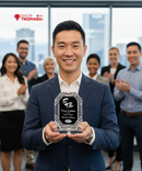 Man holding a trophy with a group of people clapping in the background, with 'Shop Trophies!' branding.
