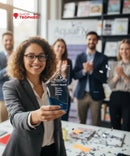 Woman holding an award with a blurred background of people clapping